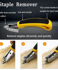 Upholstery staple remover with yellow anti-skid handle and metal tip, shown removing staples from a wooden surface.