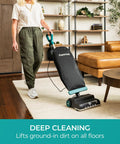 Person using Powerful Commercial Upright Vacuum Cleaner With 14 Liter Bagged Capacity on living room floor