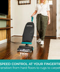Person using Powerful Commercial Upright Vacuum Cleaner with 14 Liter Bagged Capacity, LED Headlight on hardwood floor.