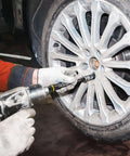 Mechanic using 1/2" Drive Torque Limiting Extension Bar Set, 10-Piece Lug Nut Torque Stick Set on car wheel lug nut