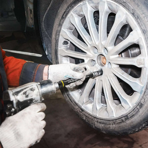 Mechanic using 1/2" Drive Torque Limiting Extension Bar Set, 10-Piece Lug Nut Torque Stick Set on car wheel lug nut
