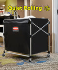 Laundry cart with black fabric and metal frame, supported by 4 inch swivel stem caster wheels, gently rolling on carpeted floor.