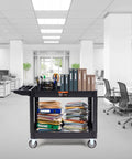 Heavy Duty 2 Shelf Utility Cart With 550 Lb Capacity And 360 Degree Swivel Wheels With Brakes in an office setting