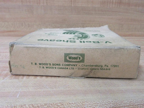 Cardboard packaging from T.B. Wood's Sons Company, Chambersburg, PA, labeled "V-Belt Sheave," placed on a wood surface.
