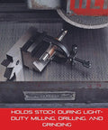 V Block And Clamp Set With Hardened Precision Ground Surfaces And Tapped Mounting Holes For Milling Drilling Grinding And Layout Work One And Five Sixteenths Inch Capacity Starrett Machinist Grade holding cylindrical workpiece on metal surface for machining.