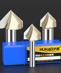 Five Piece 90 Degree V Groove Router Bit Set With One Quarter Inch Shank And Half Inch Cutter Diameter For Woodworking And CNC Engraving Carbide Tipped V Groove Bits For Precise 3D Milling And Carving, displayed in blue packaging with HUHAO branding.