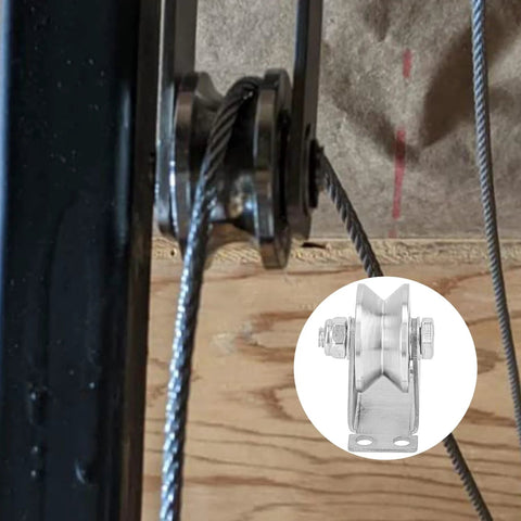 Close-up view of installed 4 Pack 2 Inch V Groove Wheel Pulley Set in 201 stainless steel with screws, supporting sliding gate cable.