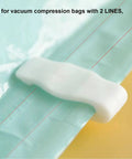 Close-up of a vacuum storage bag clip sealing a green bag. 10 Pack Vacuum Storage Bag Clips For Tight Seals And Easy Zipper Closure Space Saver Clips For Vacuum Bags Fits 2 Line Compression Bags Durable Plastic Seal Clips For Fresh Food Storage And Pantry Organization.