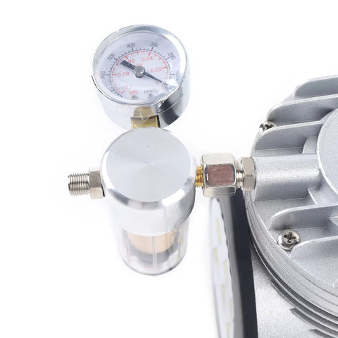 Close-up of the Oil Free Diaphragm Vacuum Pump For Food Packaging And Handicrafts with gauge and fittings, durable and portable.