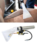 Upholstery Scrub Head Attachment For Vacuum Cleaners in use on car seat, clear scrub head with sprayed extraction nozzle for powerful cleaning.