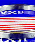 VC050CP0 Thin Section Bearing 5" x 5-3/4" x 3/8" inch chrome steel ring side view on blue background.
