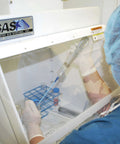 Lab technician using 18 Inch Portable Vertical Laminar Flow Hood Positive Pressure For ISO Class 5 Cleanroom Lab Use Delivers Filtered Air