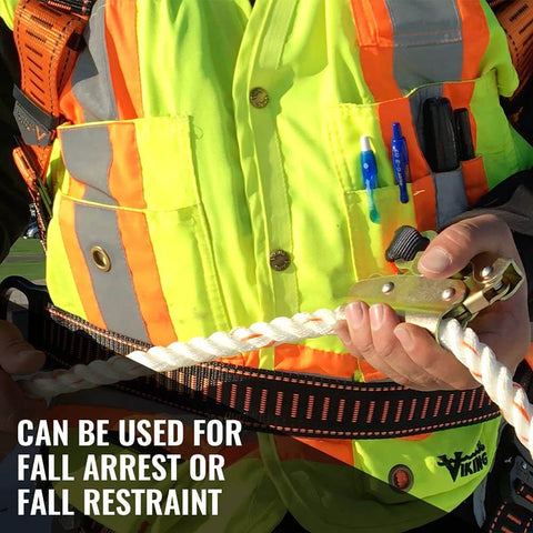 Worker holding 100-Foot Vertical Lifeline Assembly With Fall Protection Lanyard And Shock Absorber on worksite.