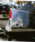 Two Pack Vertical Toggle Clamp Welding Fixture with quick-release handle on a workshop bench for heavy duty hold down in metalworking.