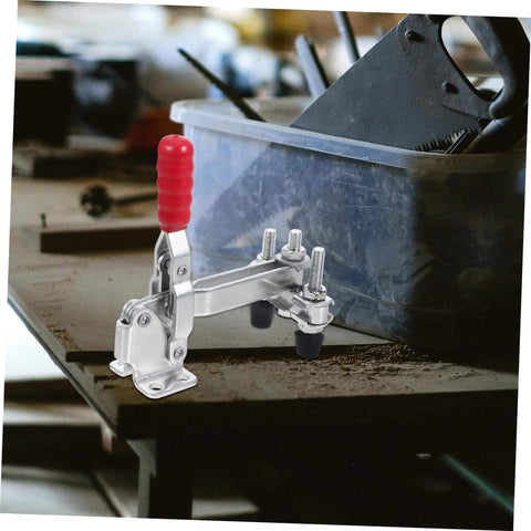 Two Pack Vertical Toggle Clamp Welding Fixture with quick-release handle on a workshop bench for heavy duty hold down in metalworking.