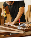 Person using a drill with Two Pack Vertical Toggle Clamp Welding Fixture for quick release heavy duty hold down on a workbench