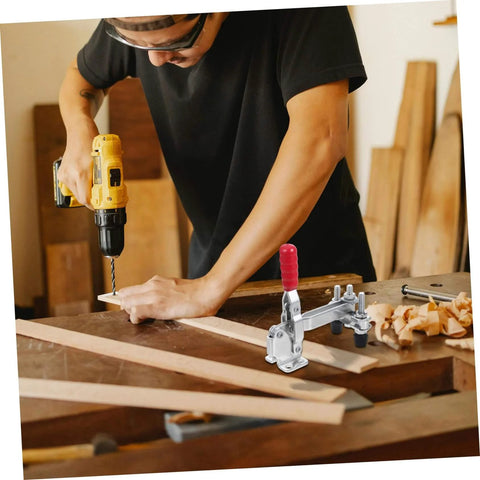 Person using a drill with Two Pack Vertical Toggle Clamp Welding Fixture for quick release heavy duty hold down on a workbench