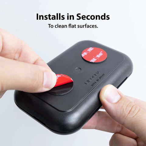 Hands applying Ultra Strong 3M VHB 5952 Adhesive Circles, 1 Inch Round, 25 Pack to a device, showcasing usage and installation.