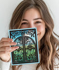 Woman holding a card made with Openable Gates Cutting Dies for Card Making and Scrapbooking Victorian Style Doorframe Embossing Die Set