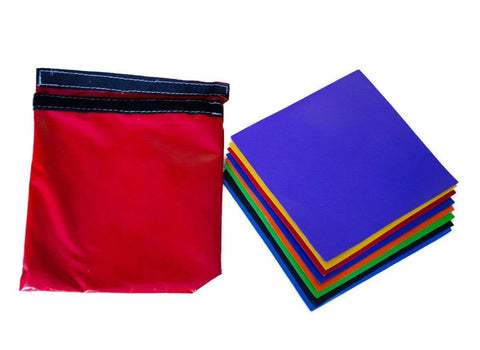 Nine 8x8 inch patches from Ultimate DIY Pro Grade Vinyl Repair Patch Kit for Commercial Inflatables, visible in assorted colors.