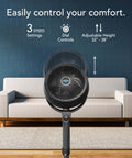 All Day Chill Pedestal Fan With Three Speed Control And Height Adjustable From 32 To 38 Inches Delivers Whole Room Air Circulation And Quiet Operation For Bedroom And Home By Vornado, shown in front of a couch in a living room setting.