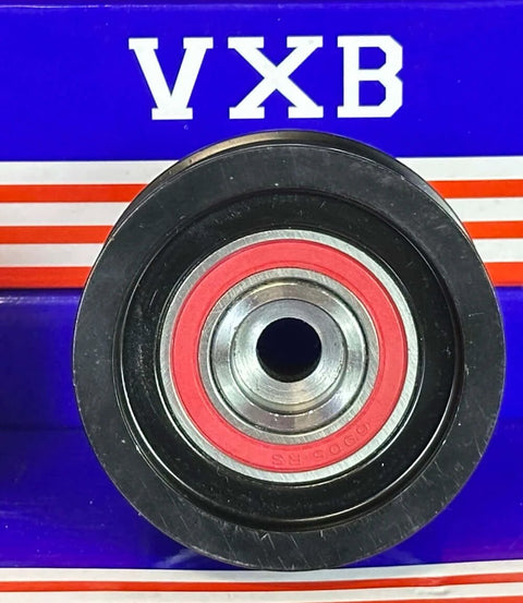 Close-up of a metal automotive bearing on a blue VXB box.