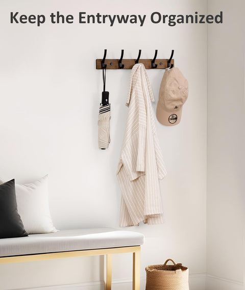 Wall Mounted Coat Rack With Two Hooks, 16.5 Inch Wood Base, holding coat, hat, and umbrella in an entryway