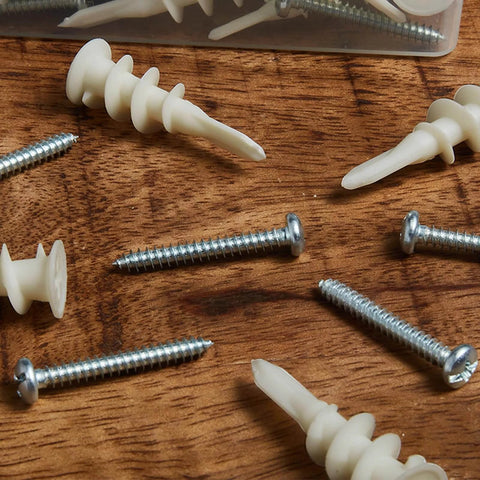 Wall Hanging Kit for Art, Frames, and Curtain Rods, 140-Piece Heavy Duty Drywall Anchor Substitute with screws on wood surface