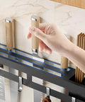 Wall Mount Utensil Rack, 15.7inch Kitchen Utensil Hanger in use holding knives and chopsticks on a wall-mounted rack