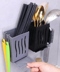 Wall-mounted multifunctional kitchen utensil rack draining chopstick holder, black finish, storing cutlery and tools in organized compartments.