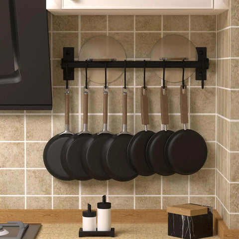 Kitchen Utensil Holder Hanger, Pot and Pan Rack Wall Mounted with 8 Hooks, Black, installed on tiled wall with frying pans hanging.