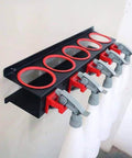 Wall Mounted Spray Bottle Rack With Five Hooks Heavy Duty Cold Rolled Steel Organizer holding spray bottles in use on wall