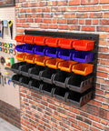 Wall Mounted Storage Bins Rack for Garage and Workshop With 30 Color Coded Bins and 2 Black Panels on brick wall