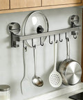 Wall Mounted Utensil Hook Rack with 8 Hooks, No Drill Installation in space gray, organizing kitchen utensils and pans on a wall.