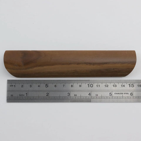 Single walnut wood drawer pull shown with ruler to highlight 157mm length, part of Walnut Wood Drawer Pulls Set Of 6 Solid Wood Furniture Handles With 5.04 Inch Hole Centers 128mm And 6.18 Inch Length 157mm 1.10 Inch Width 28mm Includes Mounting Screws For Dresser And Wardrobe Cabinets Elegant Minimalist Hardware.