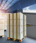 A large pallet of boxed cargo secured with straps in a warehouse, showcasing efficient storage and logistics setup.