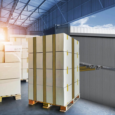 A large pallet of boxed cargo secured with straps in a warehouse, showcasing efficient storage and logistics setup.