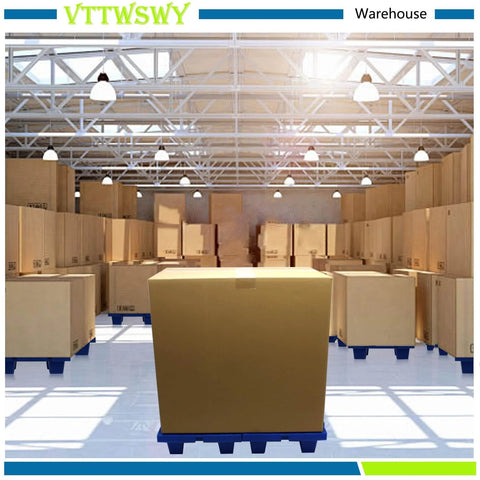 Warehouse with boxes stacked on blue pallets under bright lighting