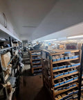 A warehouse storage area with shelves filled with boxes and marine products for 777-9001 Marine Pulley Driven Flexible Impeller Pedestal Mount Pump.