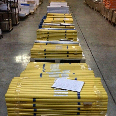 Warehouse with palleted packages of Top Notch ER70S-2 Mild Steel TIG Welding Rods Copper Coated For TIG Welds by WeldingCity.