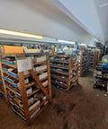 Wooden shelving with parts and components stored in a workshop or warehouse
