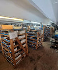 Efficient 3 inch flangemount marine blower delivers 100 CFM at 115V AC, storage room with shelves and boxed items