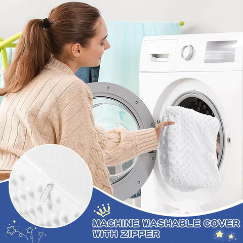 Woman placing the machine washable cover of the Memory Foam Toddler Bed Rail Bumper For All Bed Sizes With Non Slip Machine Washable Cover Safe Anti Fall Guard Rail Queen King Twin Full Size Bed Guard Protection For Child Sleep into a washing machine.