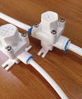 RO system pressure relief regulator with 1/4 inch tube, easy install push to connect fittings, protects against leaks and pressure spikes.