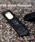 Compact multi mode pocket flashlight delivers 675 lumens, USB C recharge, IPX4 weather resistance shown on wet gravel surface