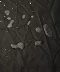 Water droplets on waterproof 420D oxford fabric, ideal for protecting top load washer from sun, dust, rain, and scratches.