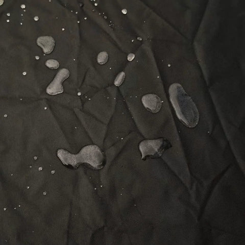 Water droplets on waterproof 420D oxford fabric, ideal for protecting top load washer from sun, dust, rain, and scratches.