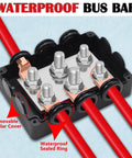 500A Marine Battery Bus Bar Heavy Duty Power Distribution Block Waterproof Automotive with M8 and M10 Studs, shown with red wiring.