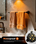 Waterproof adhesive with towels on a bathroom rack, showcasing Beefed-Up Mounting Tape With Easy Peel Tabs, 1.57 Inch Round.
