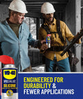 Two construction workers using WD-40 Specialist Silicone Lubricant with SMART STRAW SPRAYS 2 WAYS, 11 OZ in a wooden building site.